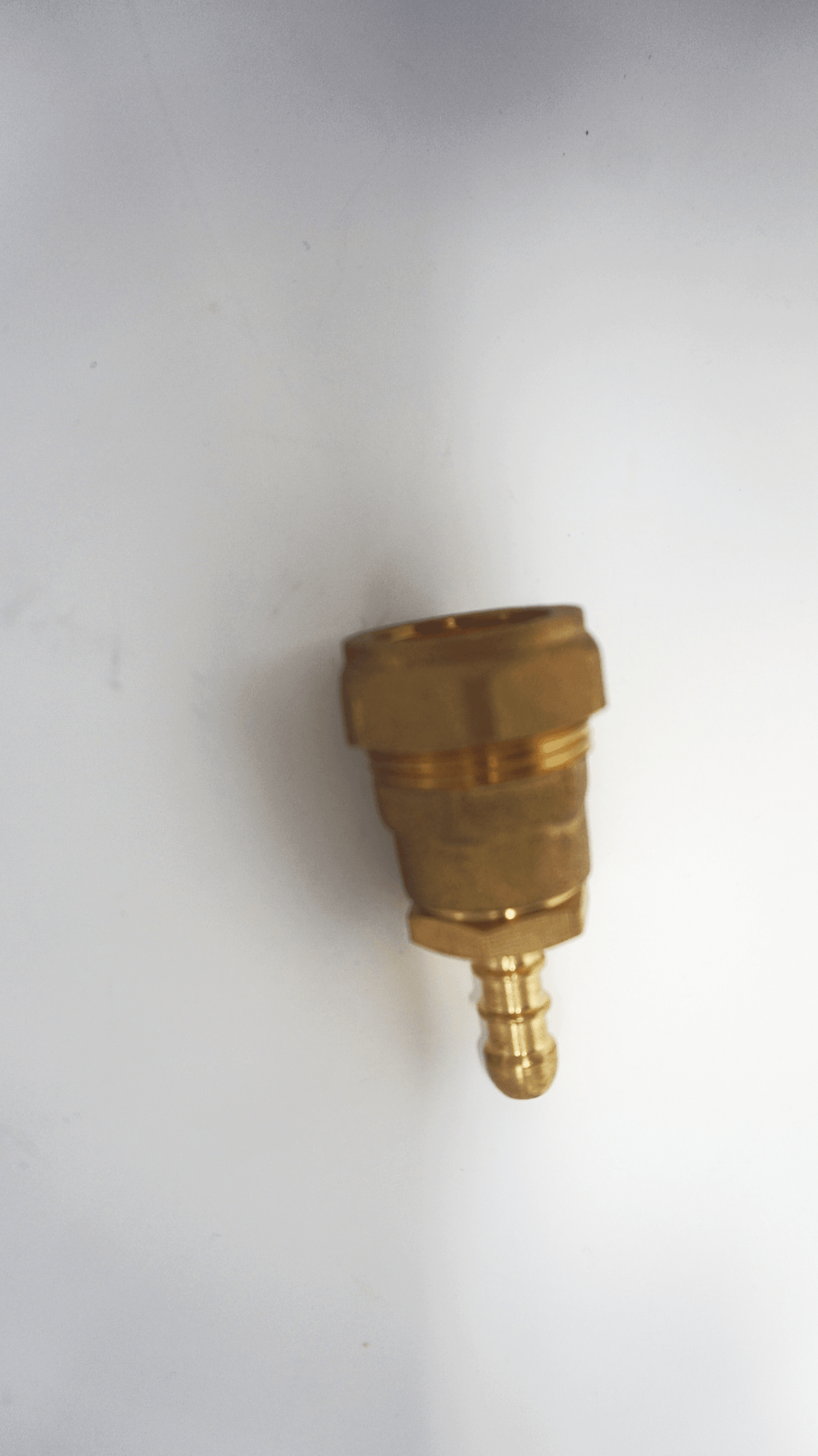 Two brass gas hose fittings connected as one, one with a 22mm compression female and the other a 1/2 inch BSP male, along with a 1/2 inch Fulham nozzle fitting.