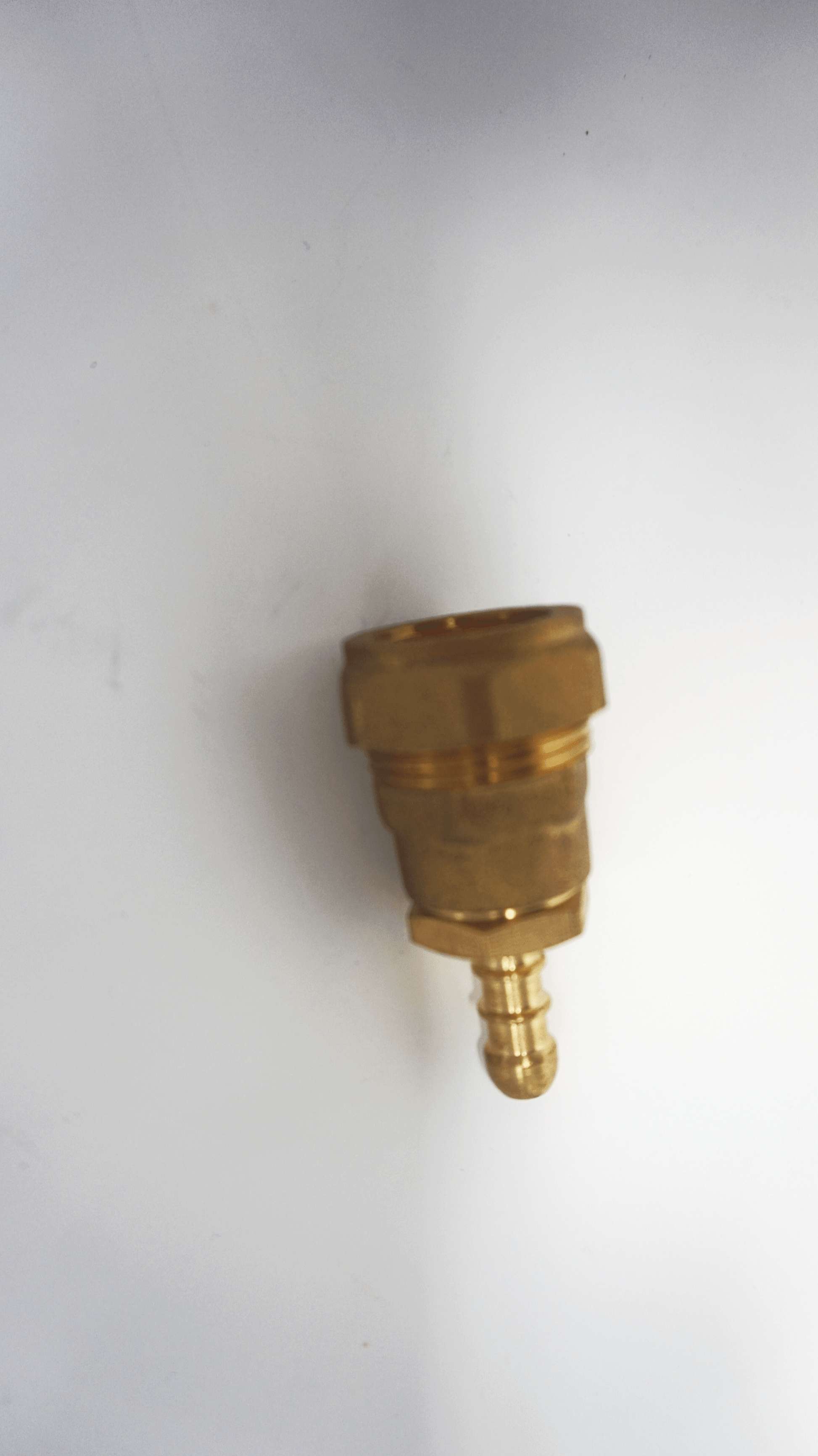 Two brass gas hose fittings connected as one, one with a 22mm compression female and the other a 1/2 inch BSP male, along with a 1/2 inch Fulham nozzle fitting.