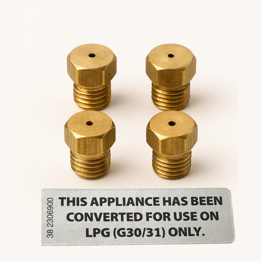 4 brass lpg jet nozzles for gas cooker/hobs pictured along with a lpg conversion label.