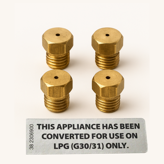 4 brass lpg jet nozzles for gas cooker/hobs pictured along with a lpg conversion label.